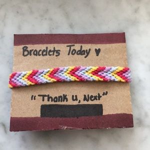 A chevron style bracelet, made of cotton thread.